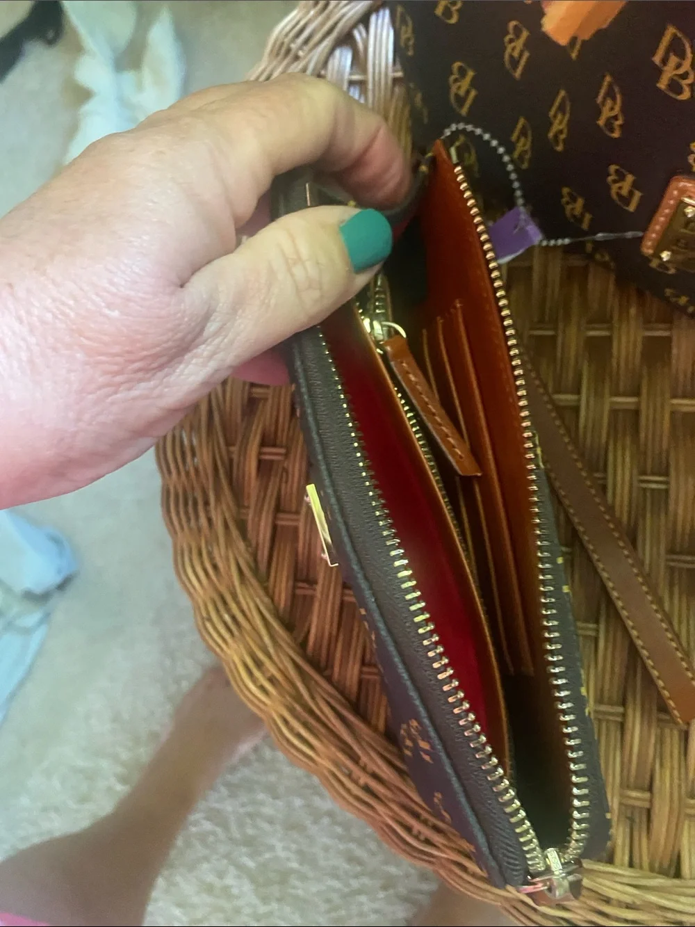 Dooney & Bourke dark brown and Gold Monogram Wristlet